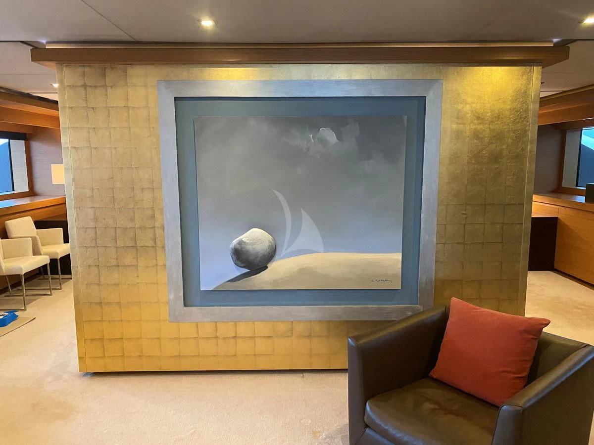 a room with a painting on the wall aboard PERSEFONI I Yacht for Sale