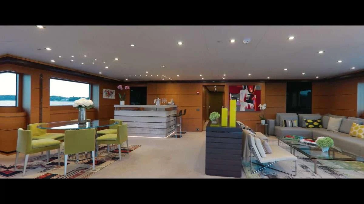 a room with a couch and a table and chairs aboard PERSEFONI I Yacht for Sale