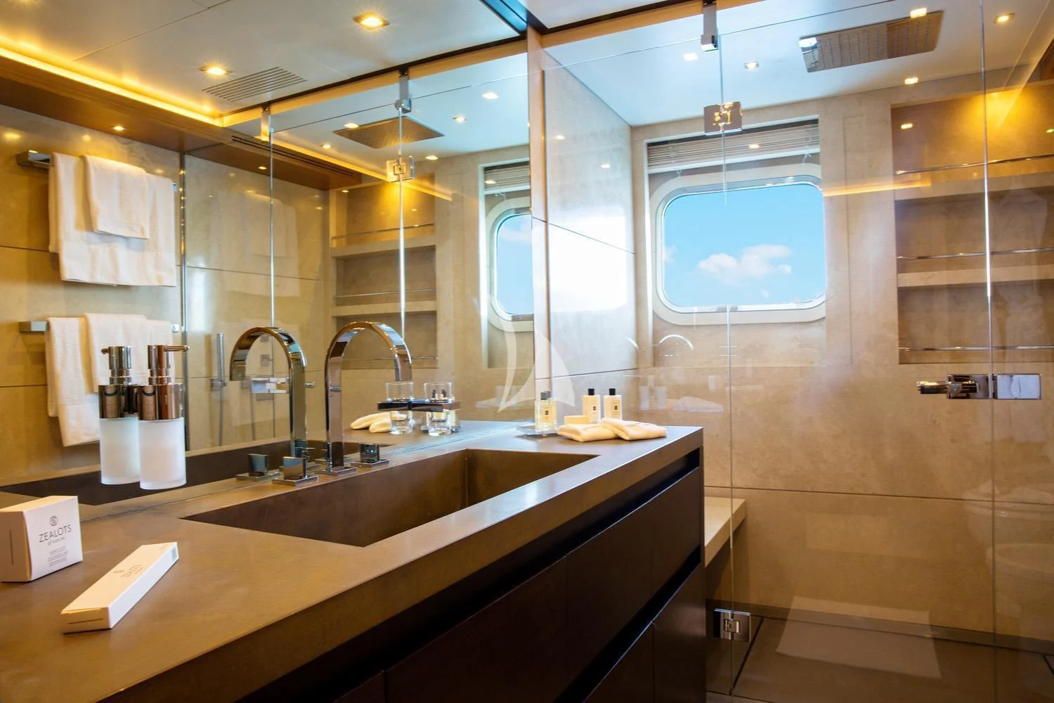 a bathroom with a large mirror aboard PERSEFONI I Yacht for Sale
