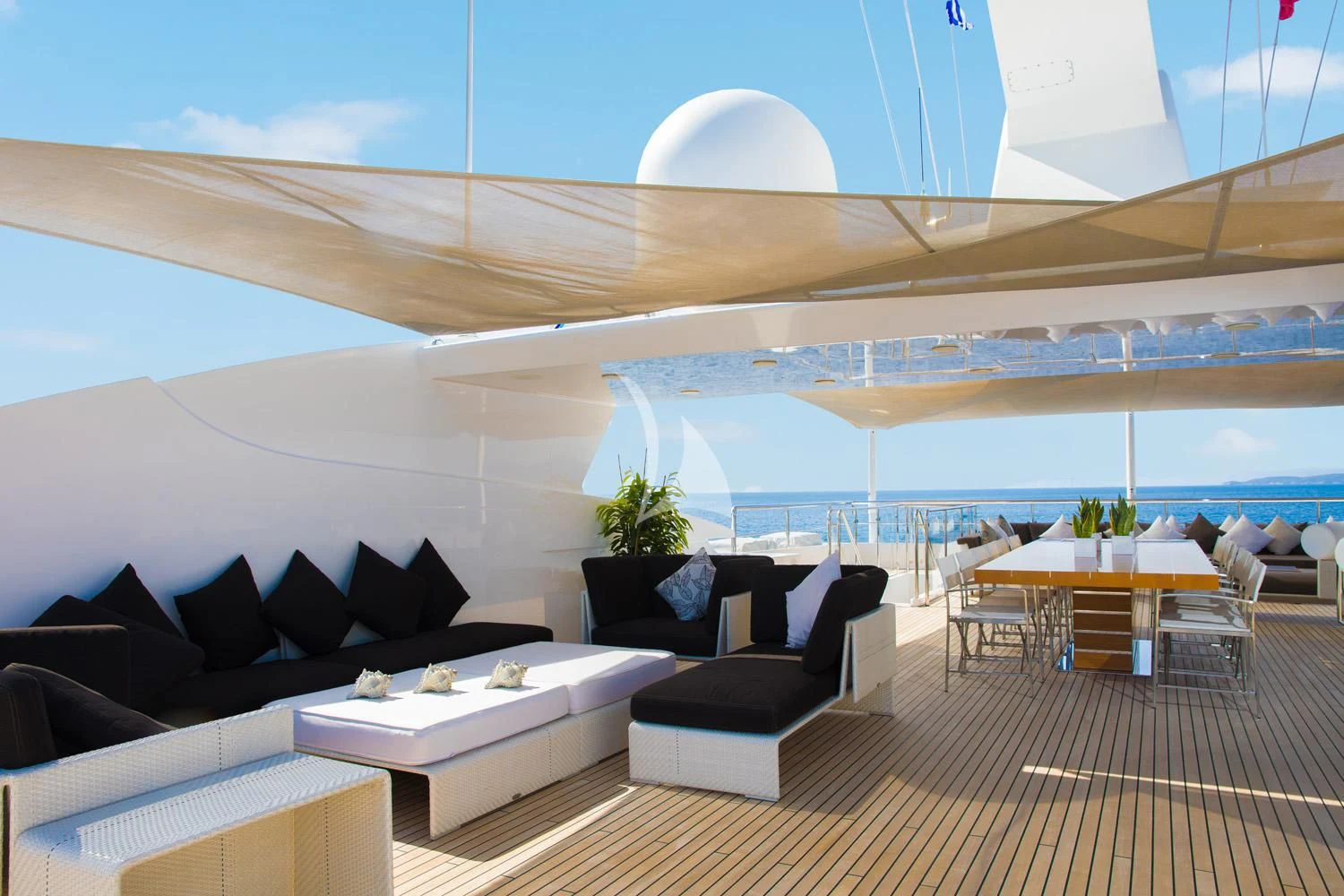 a room with a couch and a table and a large window aboard PERSEFONI I Yacht for Sale
