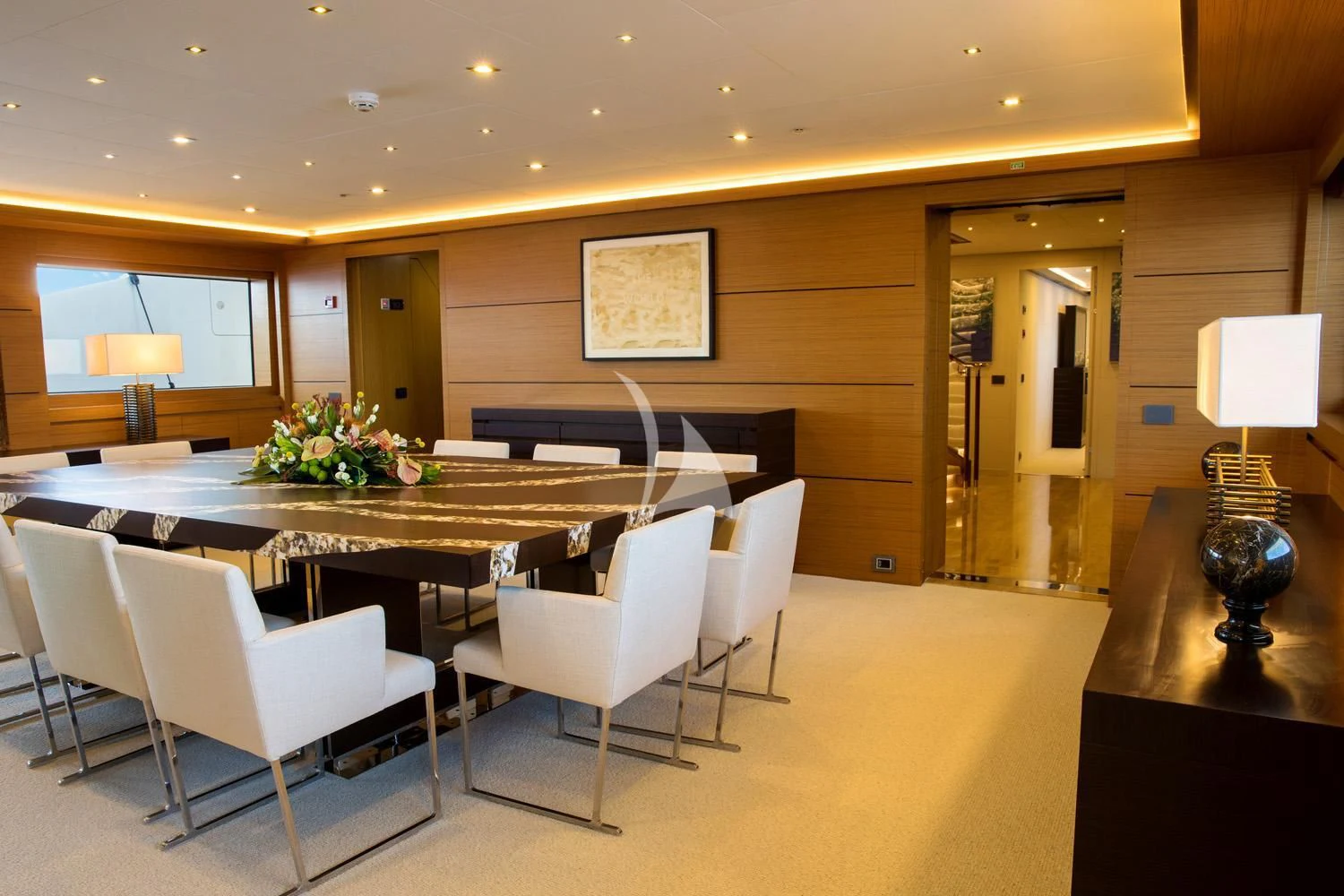 a room with a table and chairs aboard PERSEFONI I Yacht for Sale