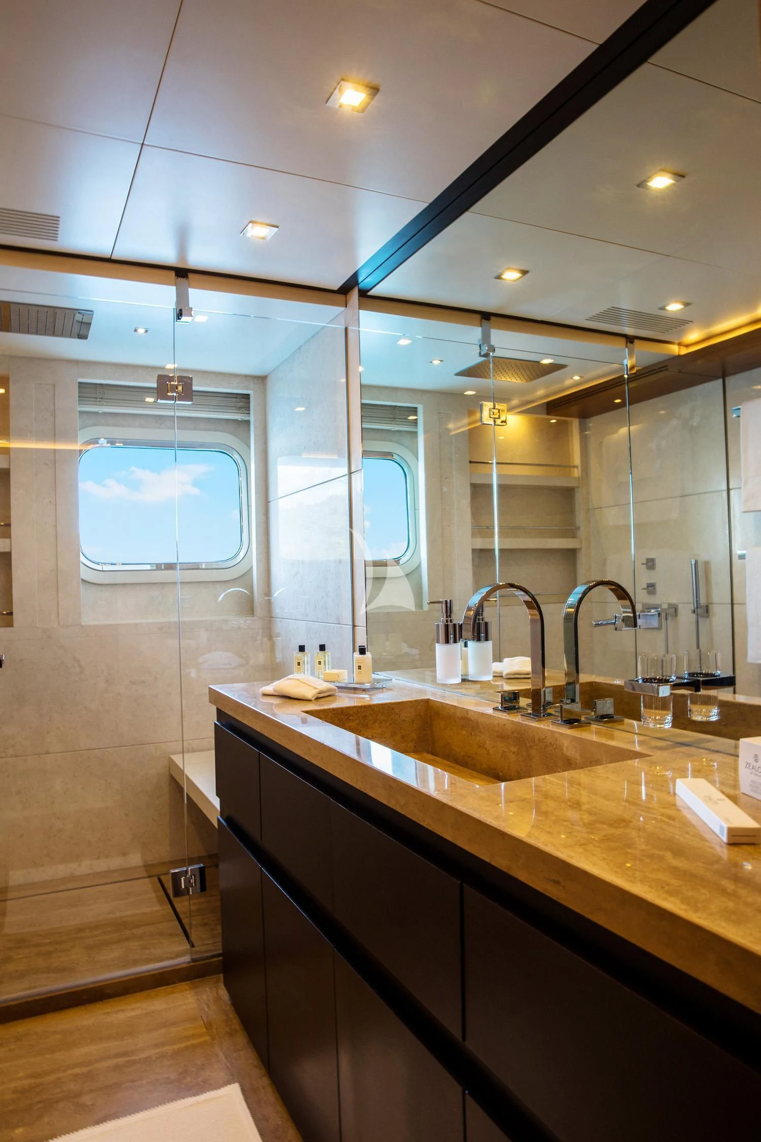 a bathroom with a large mirror aboard PERSEFONI I Yacht for Sale