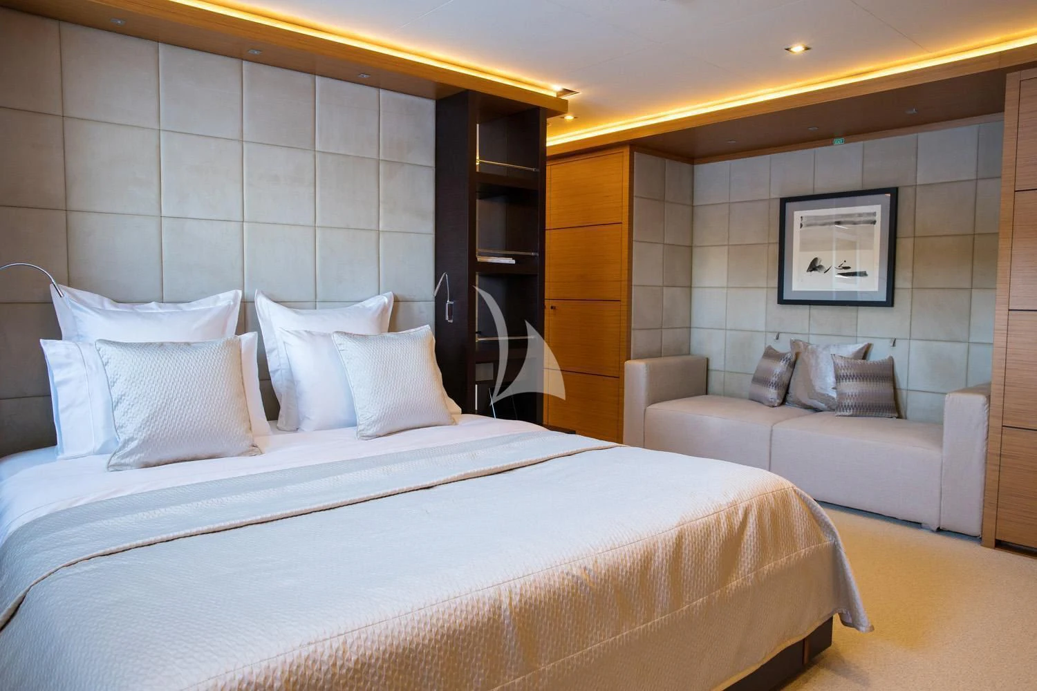 a hotel room with a bed and a desk aboard PERSEFONI I Yacht for Sale