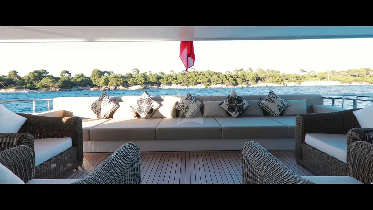 a couch and a table with chairs aboard PERSEFONI I Yacht for Sale