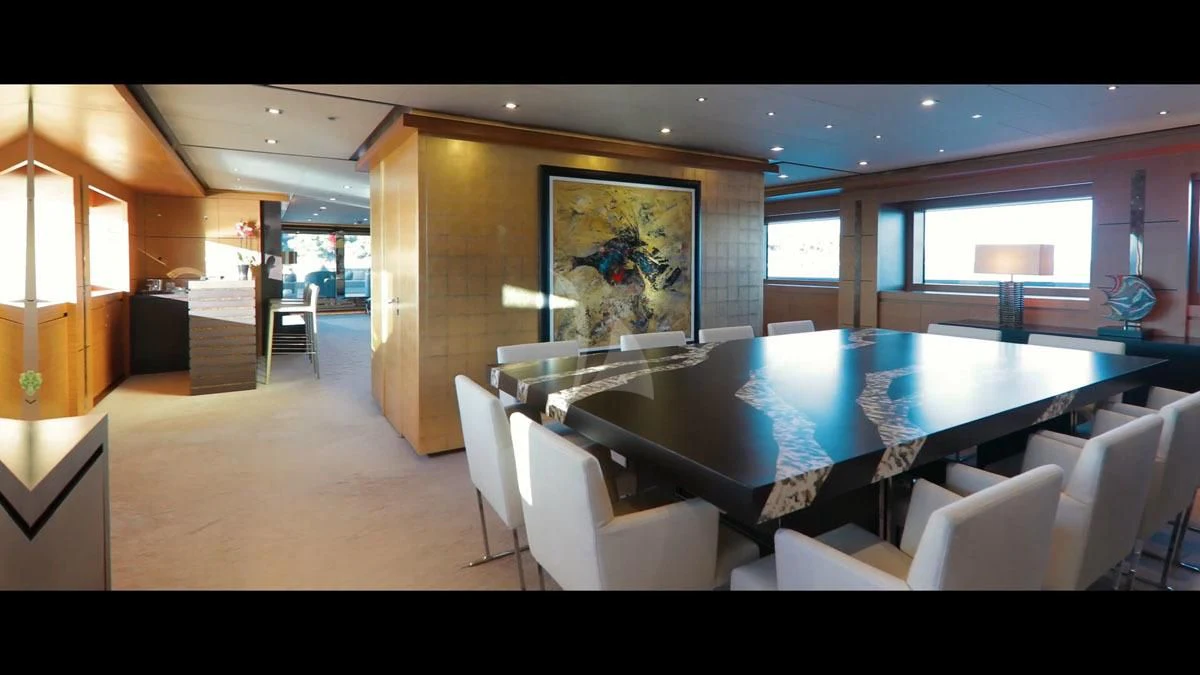 a large room with a pool table and chairs aboard PERSEFONI I Yacht for Sale