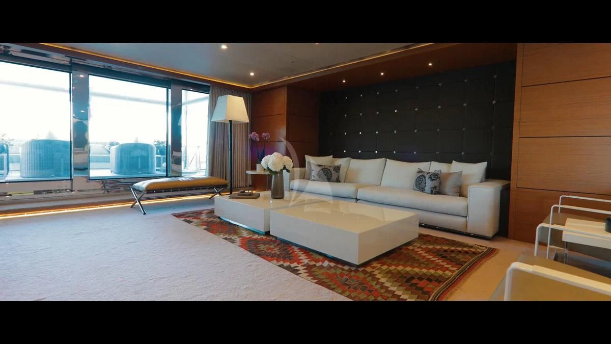 a living room with a large window aboard PERSEFONI I Yacht for Sale