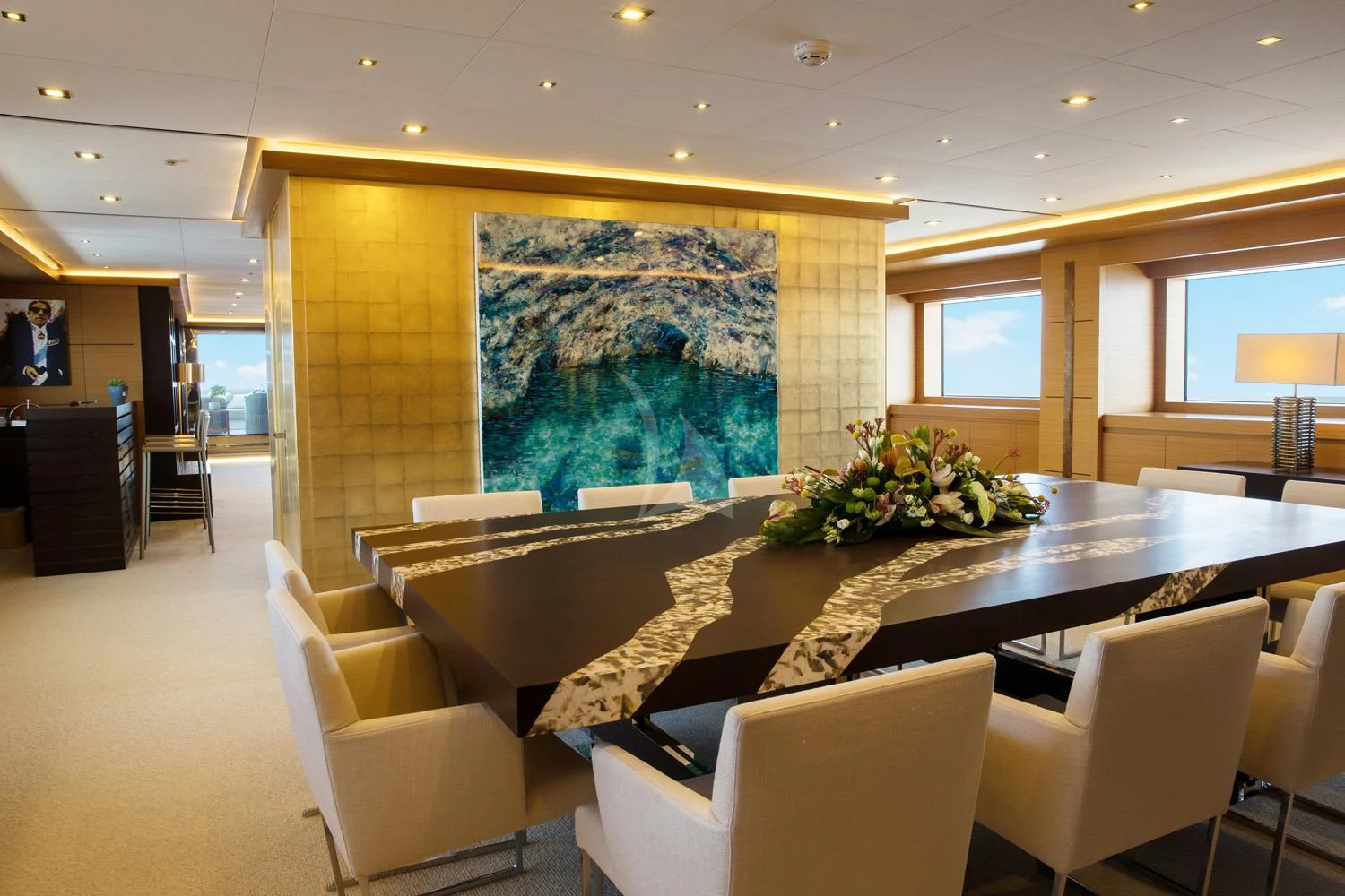 a large room with a large painting aboard PERSEFONI I Yacht for Sale