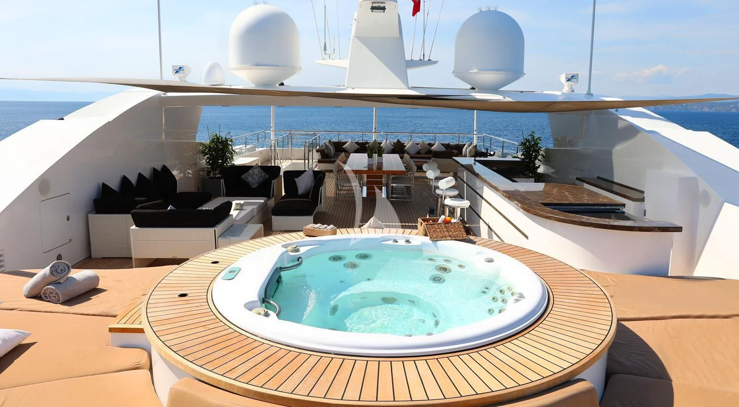 a large room with a round table and chairs aboard PERSEFONI I Yacht for Sale