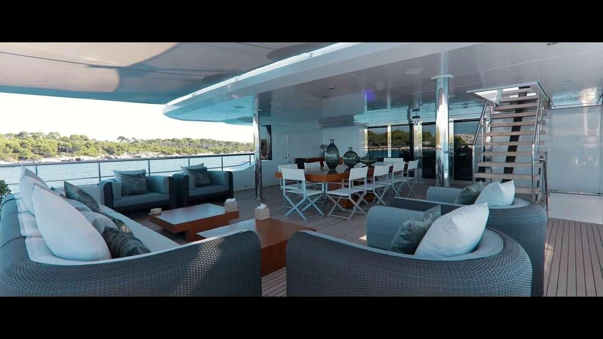 a living room with a large open roof aboard PERSEFONI I Yacht for Sale