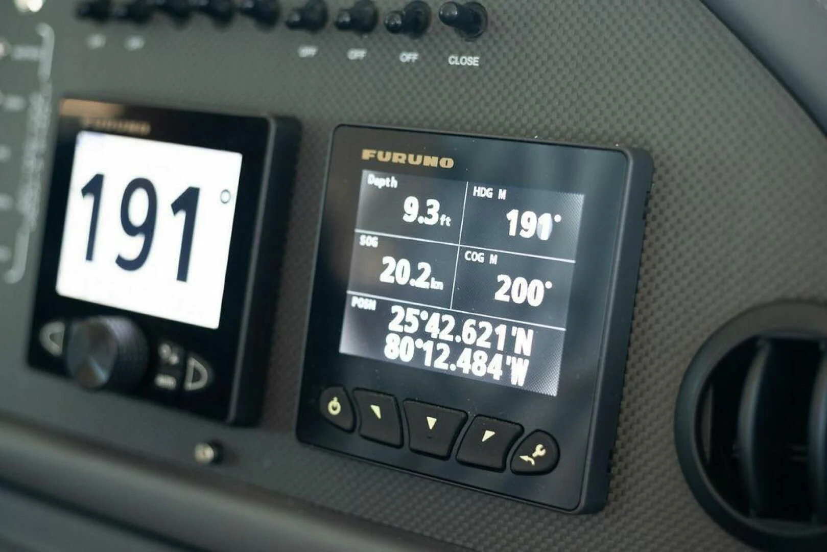 a close-up of a car dash aboard VIDI Yacht for Sale