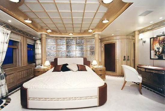 a large bedroom with a large bed aboard TUEQ Yacht for Sale