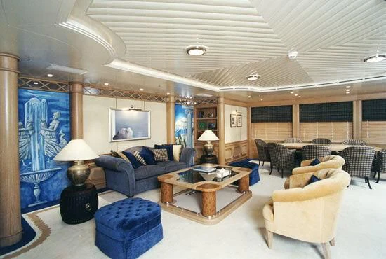 a large room with a large screen aboard TUEQ Yacht for Sale