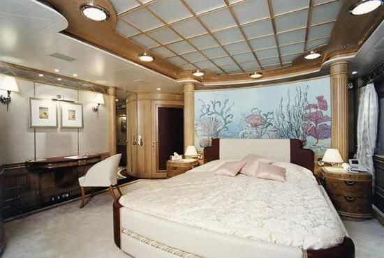 a large bedroom with a large bed aboard TUEQ Yacht for Sale