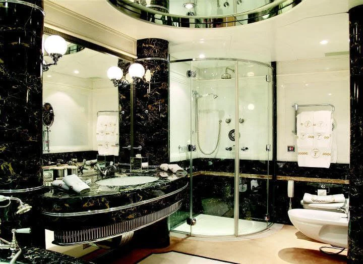 a bathroom with a large glass shower aboard TUEQ Yacht for Sale