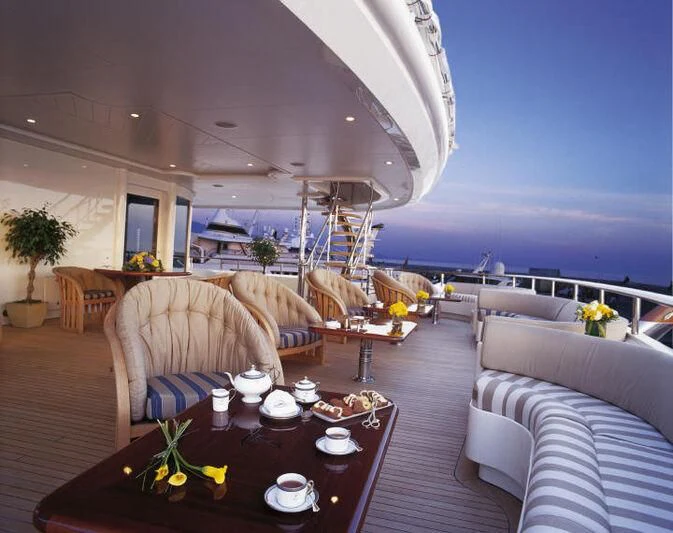 a living room with a large open roof aboard TUEQ Yacht for Sale