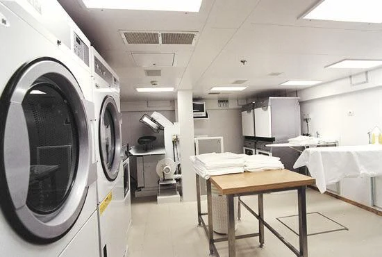 a machine in a room aboard TUEQ Yacht for Sale