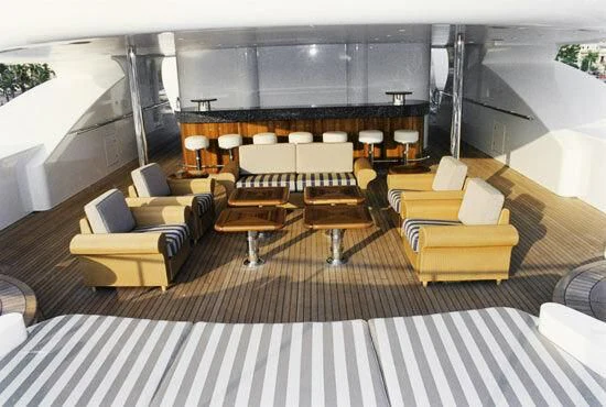 a room with chairs and tables aboard TUEQ Yacht for Sale