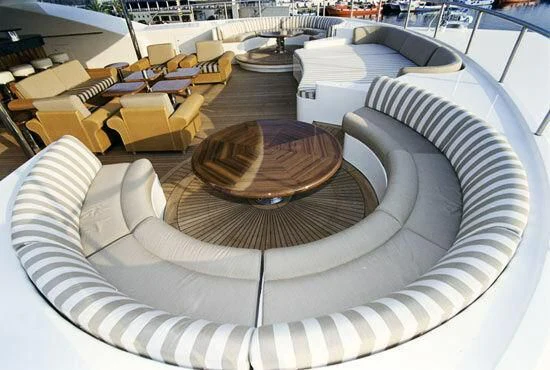 a large room with chairs and tables aboard TUEQ Yacht for Sale