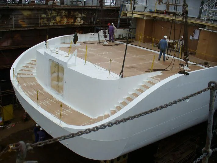a large white model of a ship aboard TUEQ Yacht for Sale