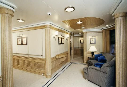a living room with a large mirror aboard TUEQ Yacht for Sale