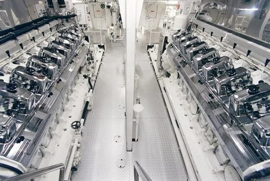 a large factory with many cars aboard TUEQ Yacht for Sale