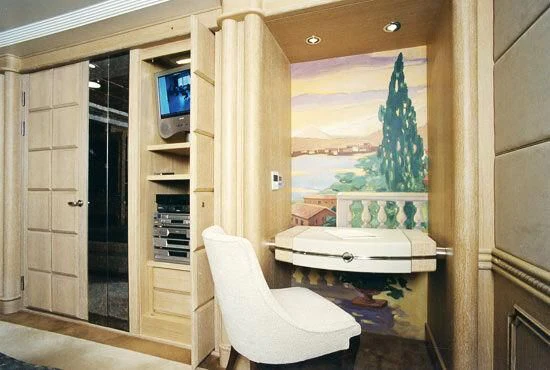 a room with a chair and a table and a window aboard TUEQ Yacht for Sale