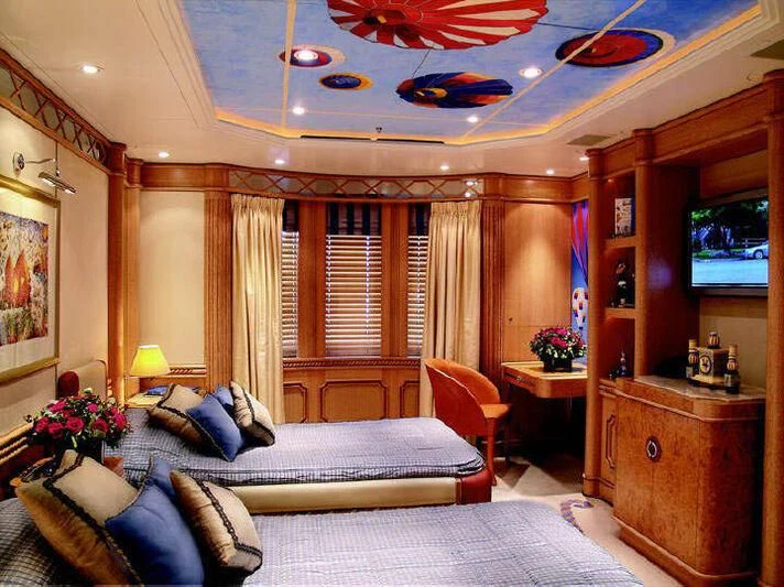 a large bedroom with a large bed aboard TUEQ Yacht for Sale