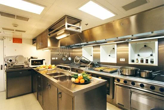 a kitchen with a stove and a sink aboard TUEQ Yacht for Sale