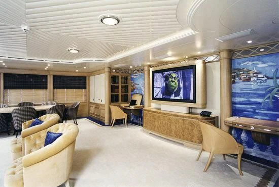 a room with a large screen aboard TUEQ Yacht for Sale