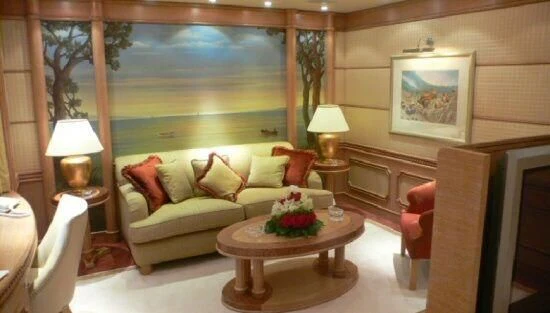a living room with a couch and a table aboard TUEQ Yacht for Sale