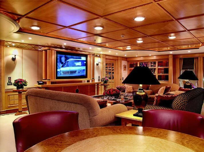 a living room with a large television aboard TUEQ Yacht for Sale