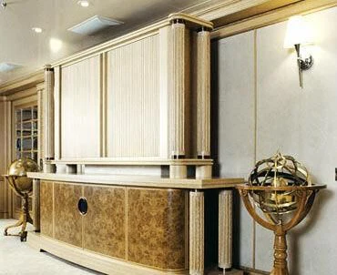 a room with a fan and a shelf with a lamp aboard TUEQ Yacht for Sale