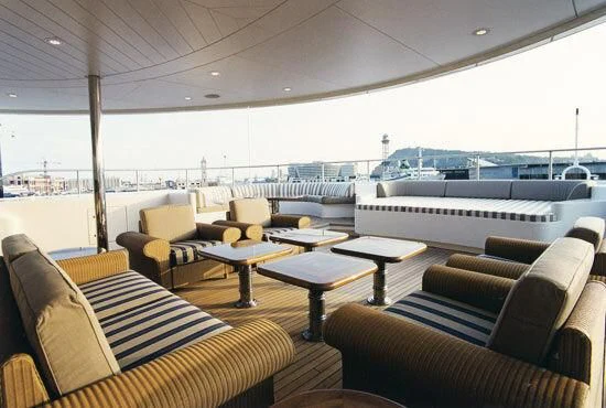 a room with couches and tables aboard TUEQ Yacht for Sale