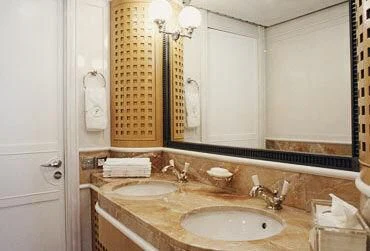 a bathroom with a sink and a mirror aboard TUEQ Yacht for Sale