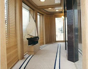 a hallway with a large mirror aboard TUEQ Yacht for Sale