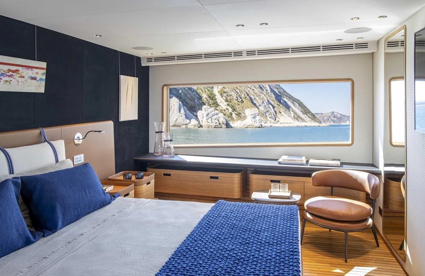 a bedroom with a large painting aboard UPSTREAM Yacht for Sale