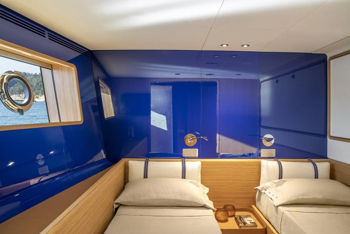 a room with a bed and a window aboard UPSTREAM Yacht for Sale