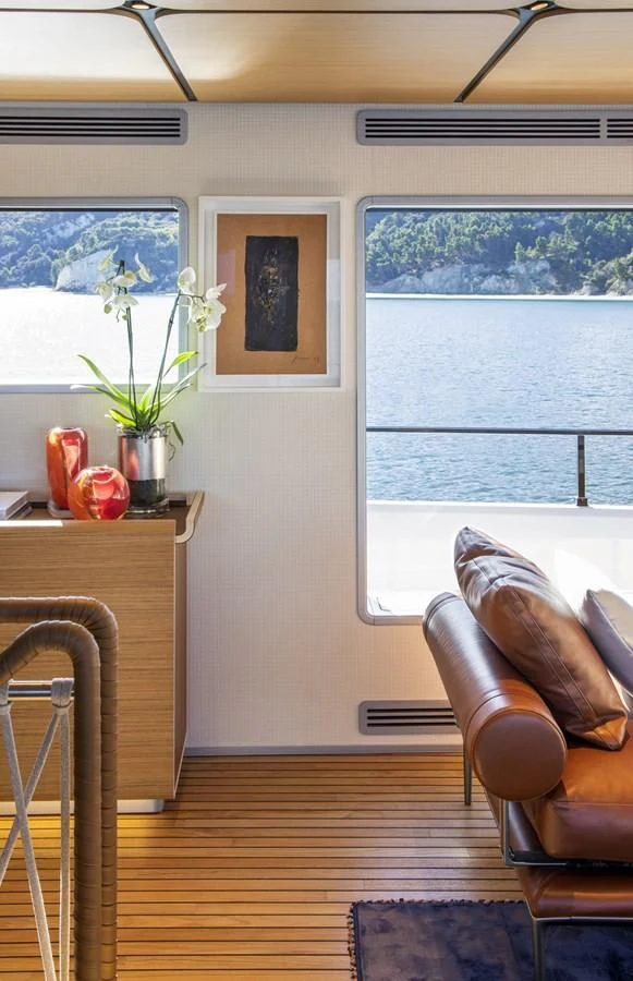 a room with a table and chairs aboard UPSTREAM Yacht for Sale