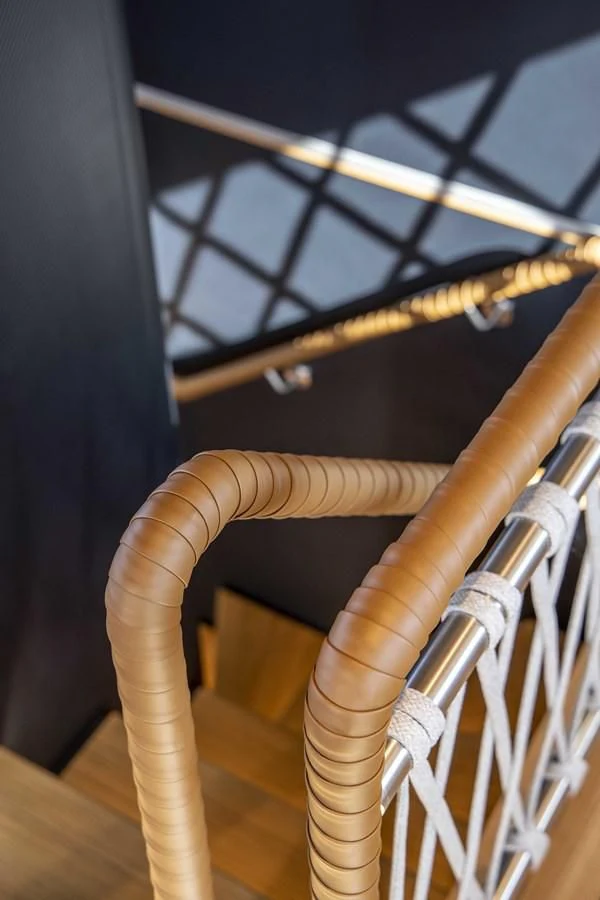 a close-up of a wooden chair aboard UPSTREAM Yacht for Sale