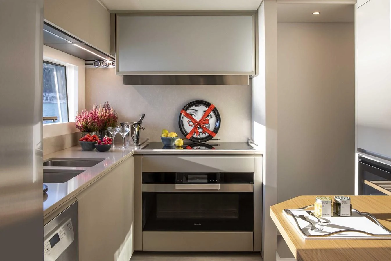 a kitchen with a stove and sink aboard UPSTREAM Yacht for Sale