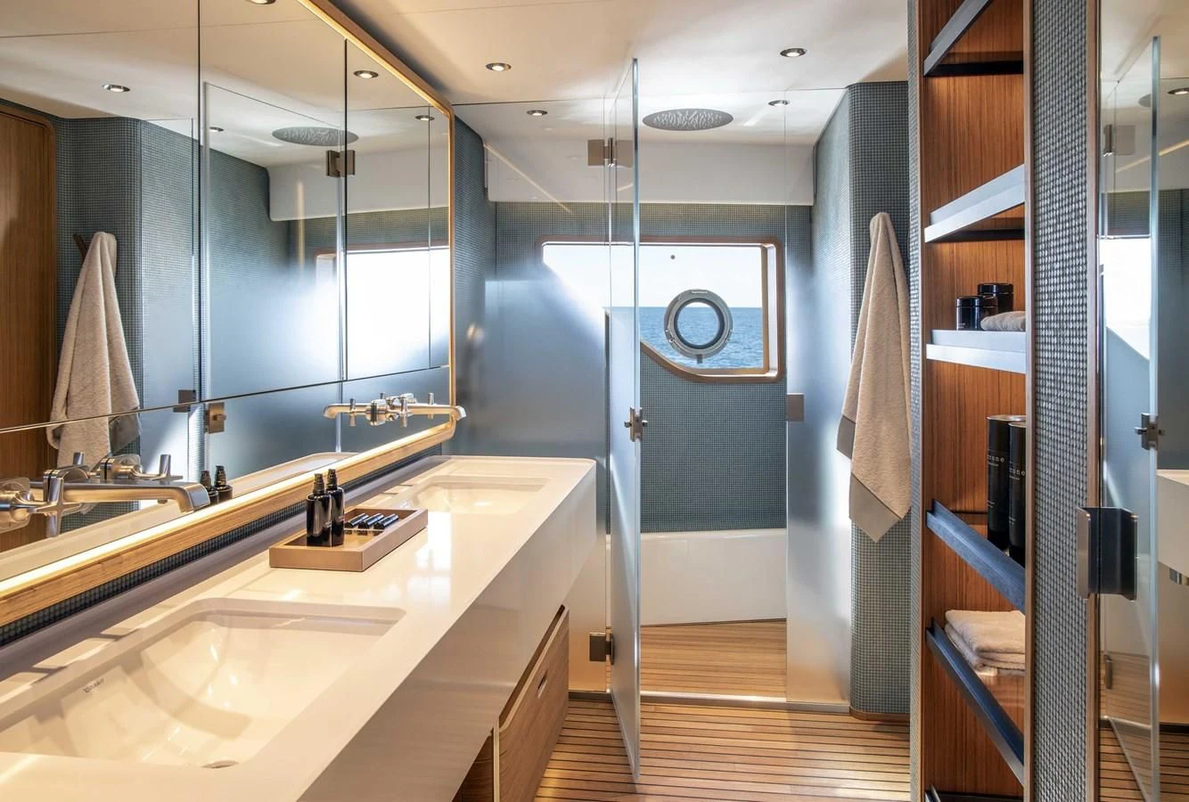 a bathroom with a sink and a mirror aboard UPSTREAM Yacht for Sale