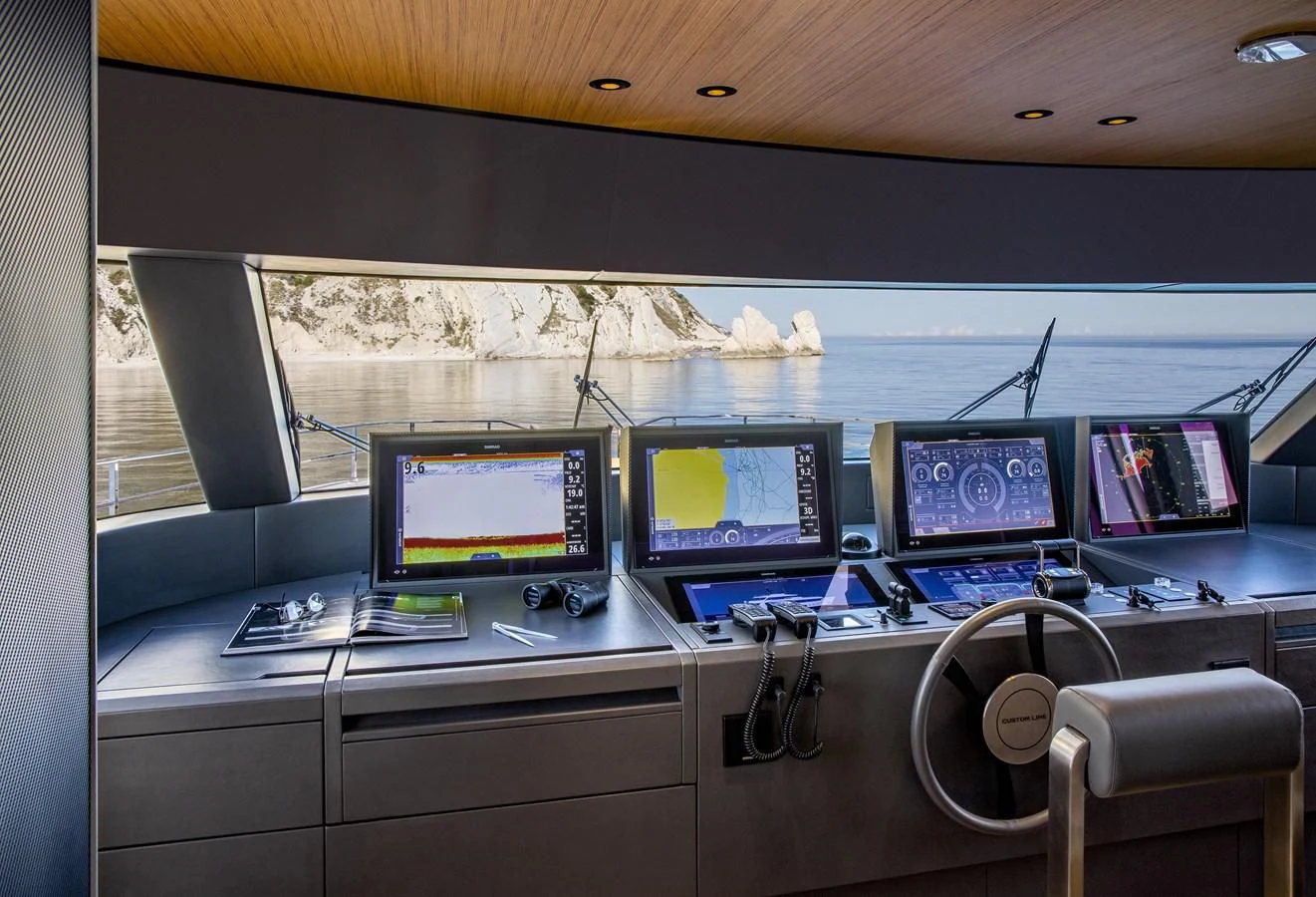a desk with computers and monitors aboard UPSTREAM Yacht for Sale