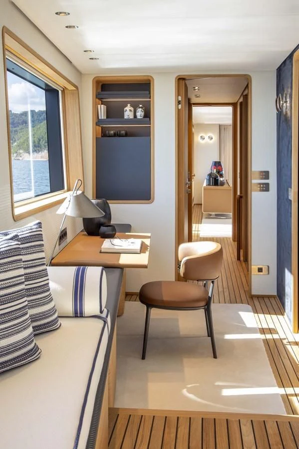 a room with a desk and a chair aboard UPSTREAM Yacht for Sale