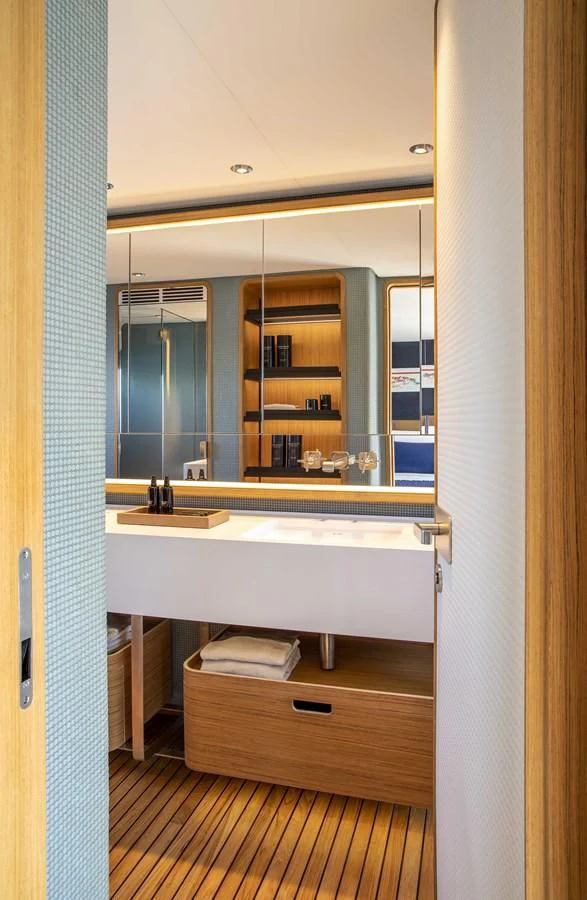 a bathroom with a sink and a mirror aboard UPSTREAM Yacht for Sale