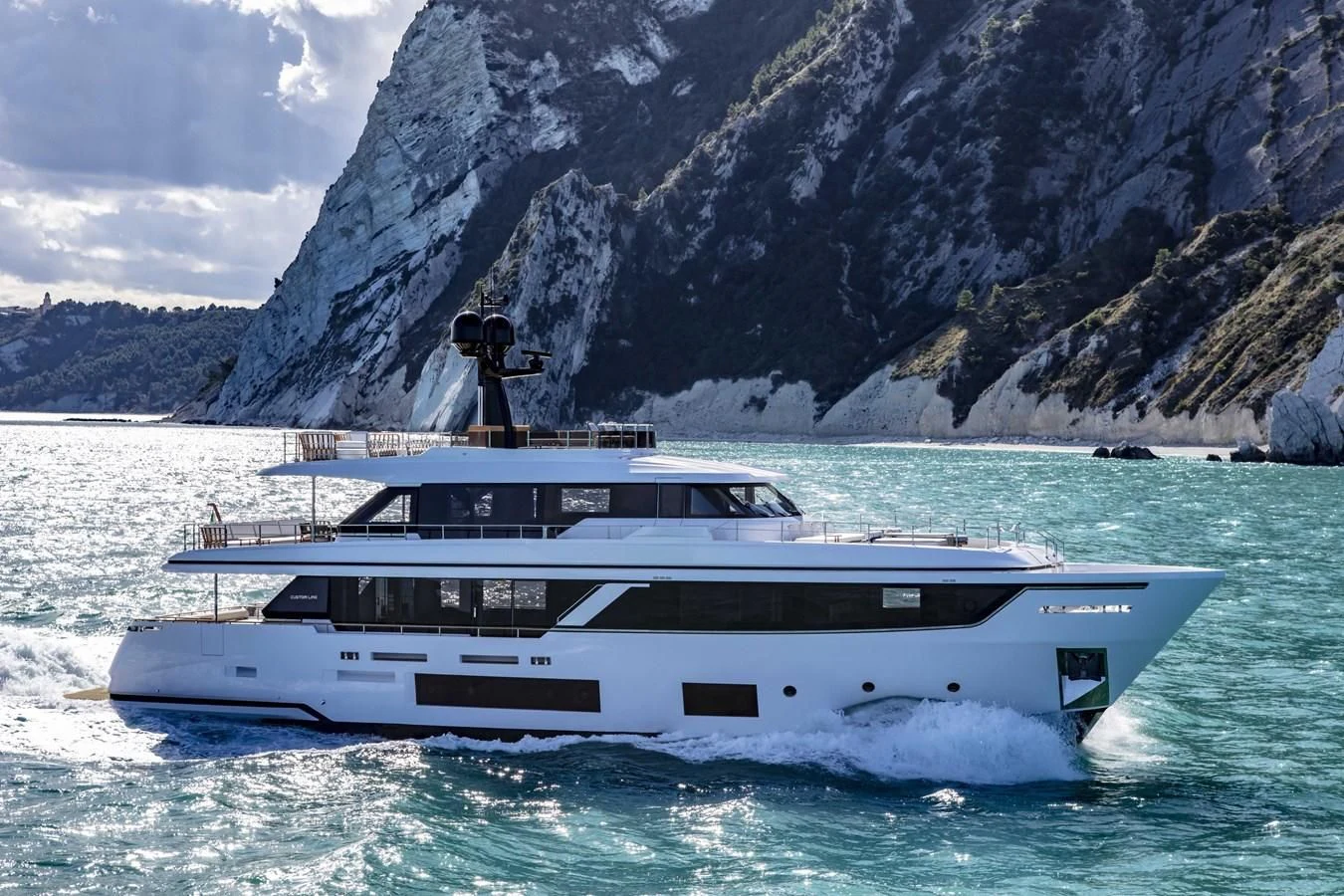 a person standing on a boat in the water aboard UPSTREAM Yacht for Sale