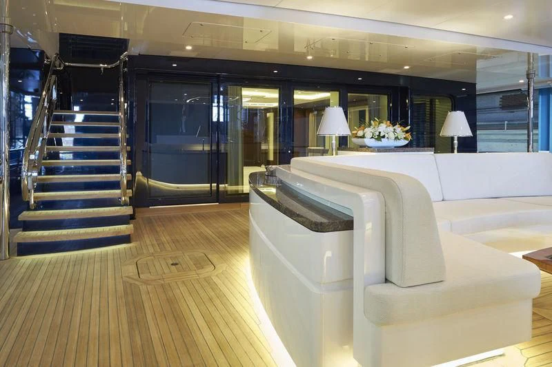 a large room with a couch and a table aboard HAMPSHIRE Yacht for Sale