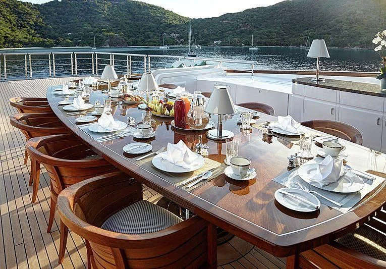 a table set with plates and cups aboard HAMPSHIRE Yacht for Sale