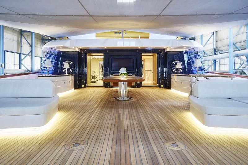 a room with a wood floor and a tv on the wall aboard HAMPSHIRE Yacht for Sale