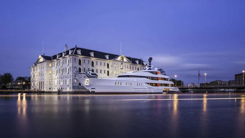 a large white boat on a river aboard HAMPSHIRE Yacht for Sale