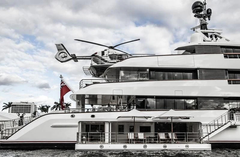 a helicopter flying over a cruise ship aboard HAMPSHIRE Yacht for Sale